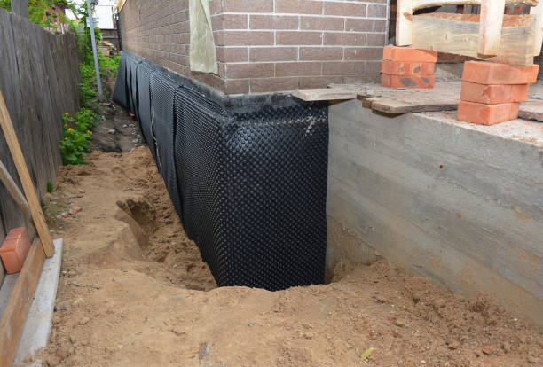 Happy homeowners after waterproofing job in Converse